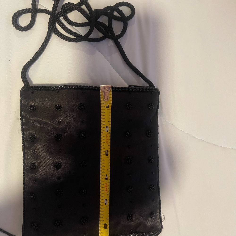 Satin beaded crossbody black purse.Zip closure. 6”x6”x1”  and 21” Handle - Picture 6 of 9